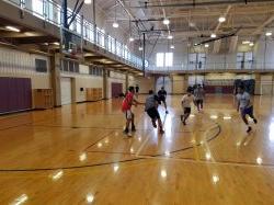 Group of male students playing basketball