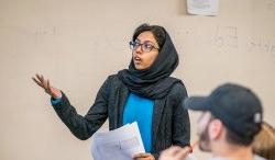 Woman lecturing in classroom