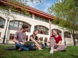 Students sitting on lawn